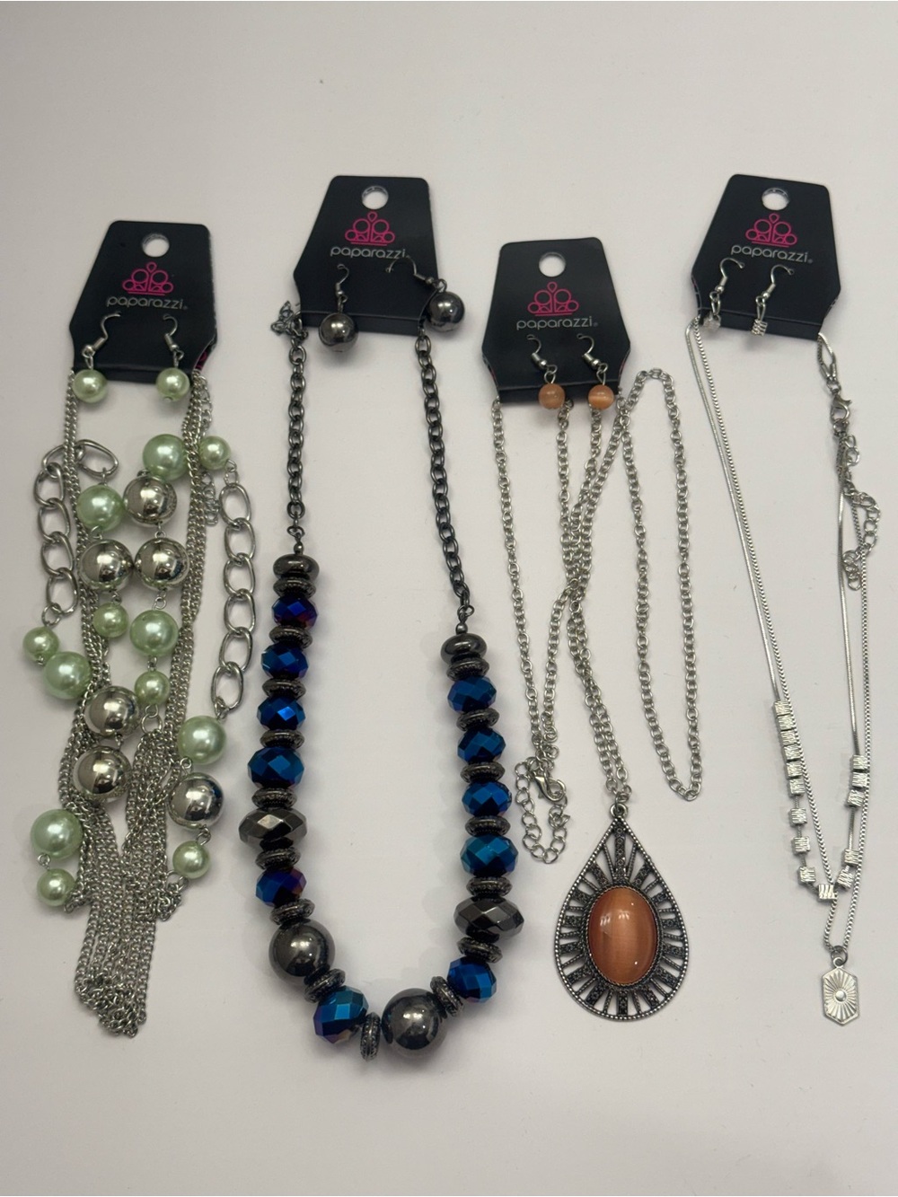 4 Paparazzi beautiful sets necklace with earrings new in bag.